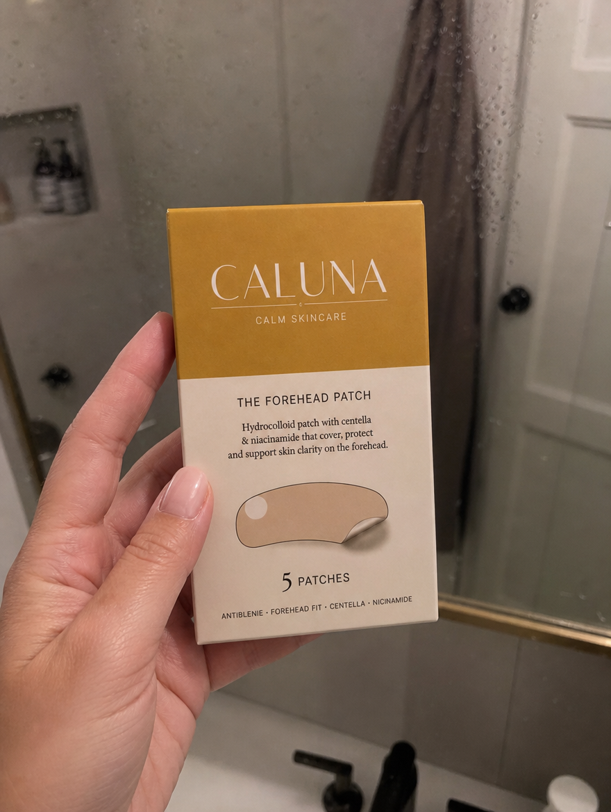 Holding The Forehead Patch box at the bathroom mirror