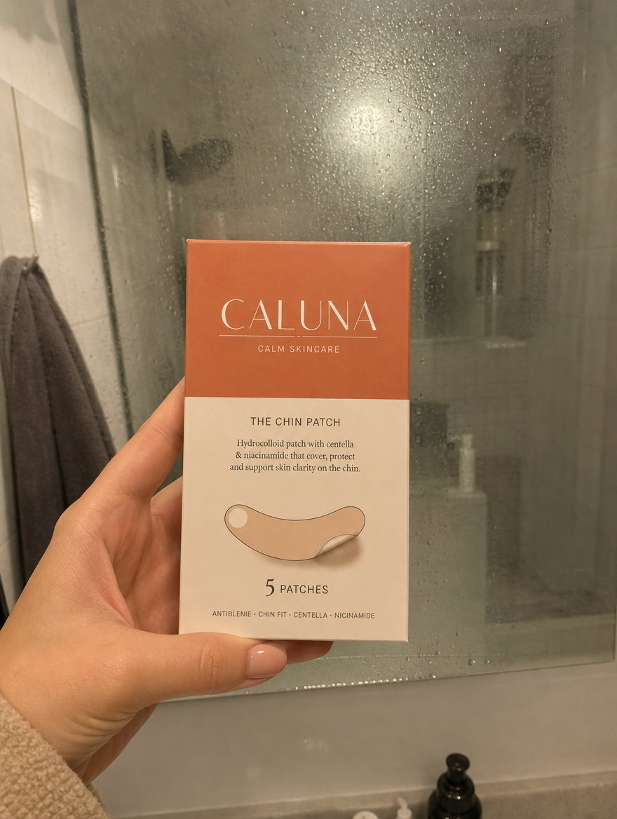 Holding The Chin Patch box at the bathroom mirror