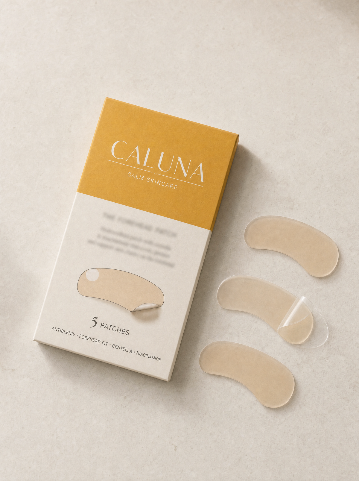 The Forehead Patch box flat-lay with three loose wide hydrocolloid bands