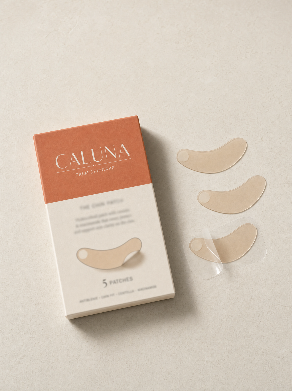 The Chin Patch box flat-lay with three loose curved hydrocolloid patches